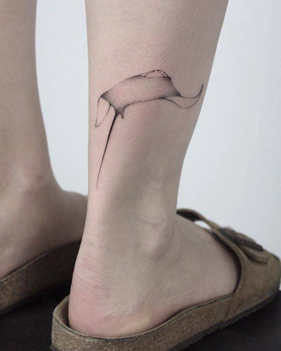 Abstract tattoo on the right calf by Lara M J
