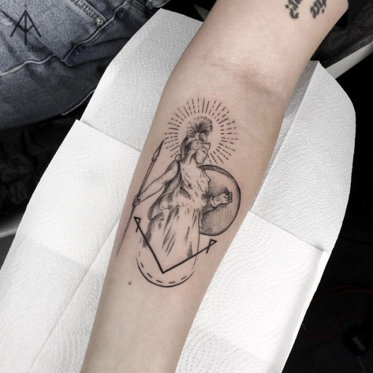 Athena tattoo on the forearm
