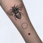 Bee, circle, and dot tattoo
