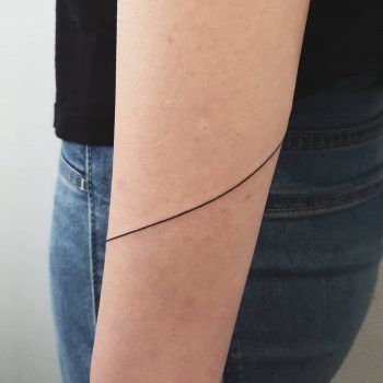 Bent line tattoo done at Mu Body Arts Studio