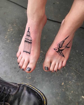 Bird and cage tattoos on feet