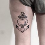 Black anchor and heart tattoo