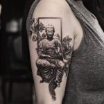 Black and grey Buddha tattoo