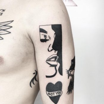 Black and white kiss tattoo