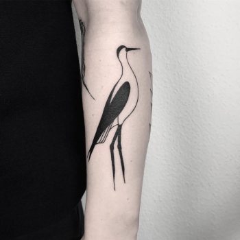 Black and white stork tattoo