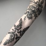 Black floral pieces on the arm