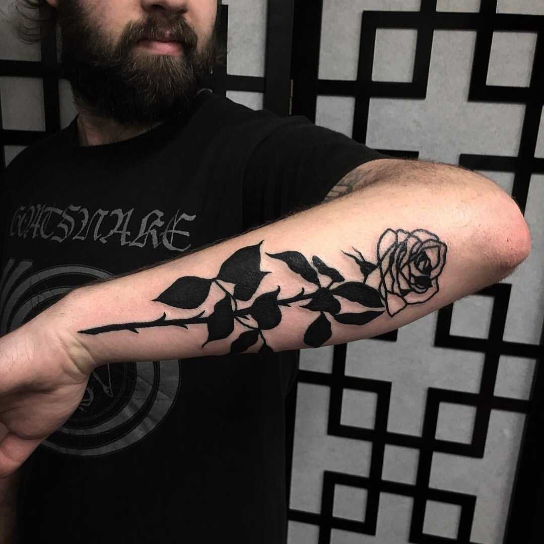 Black rose tattoo on the left forearm - Tattoogrid.net