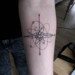 Blackwork atom symbol tattoo