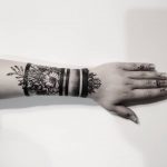 Blackwork floral armband tattoo