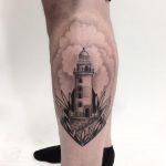 Blackwork lighthouse on the calf