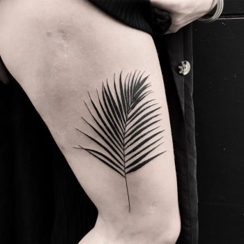 Blackwork palm leaf tattoo