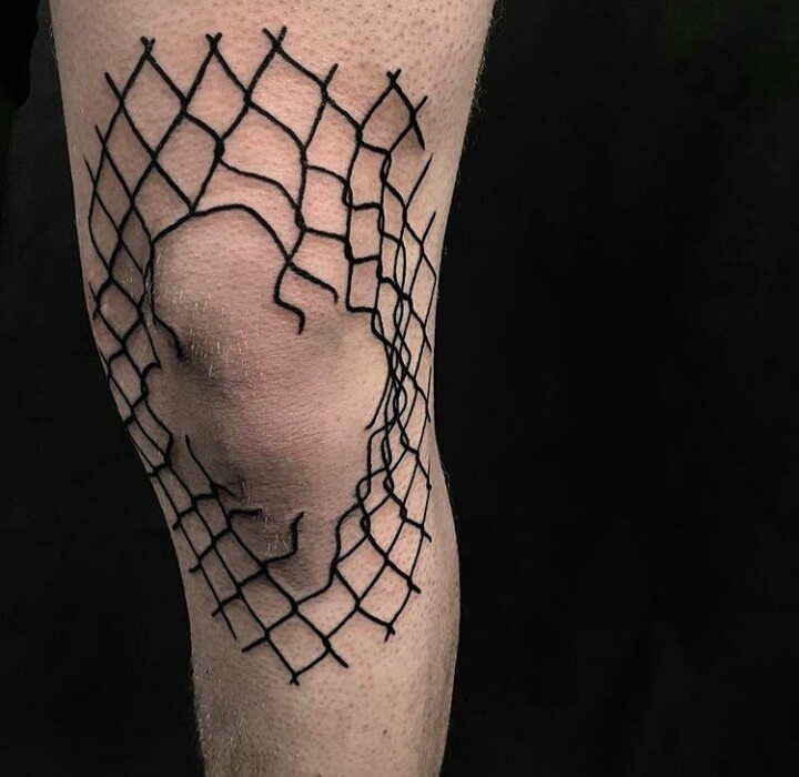 Broken fence tattoo on the right leg