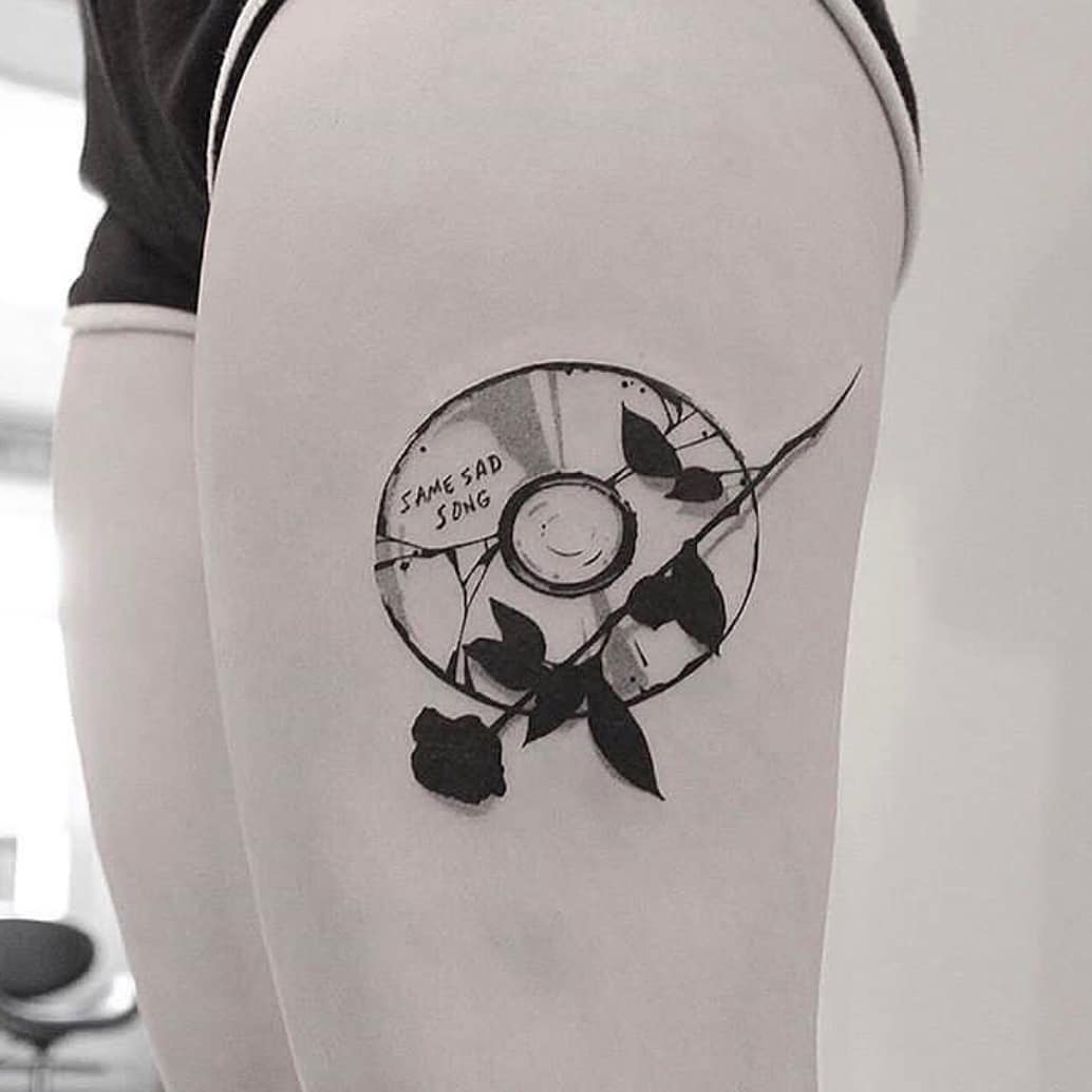 CD and black rose tattoo