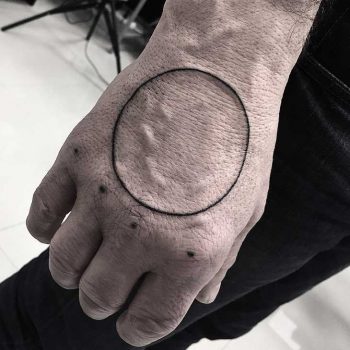 Circle and five dots tattoo by Jay Lester