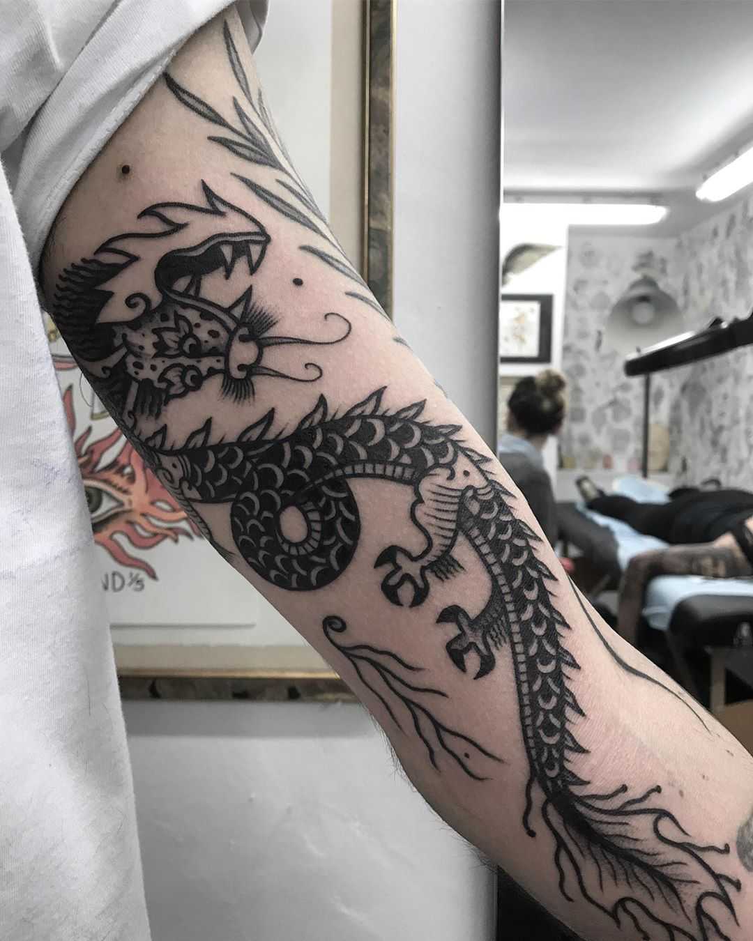Cool black dragon tattoo