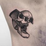 Cool deconstructed skull tattoo