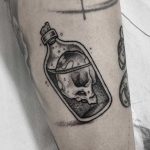 Creepy message in a bottle tattoo
