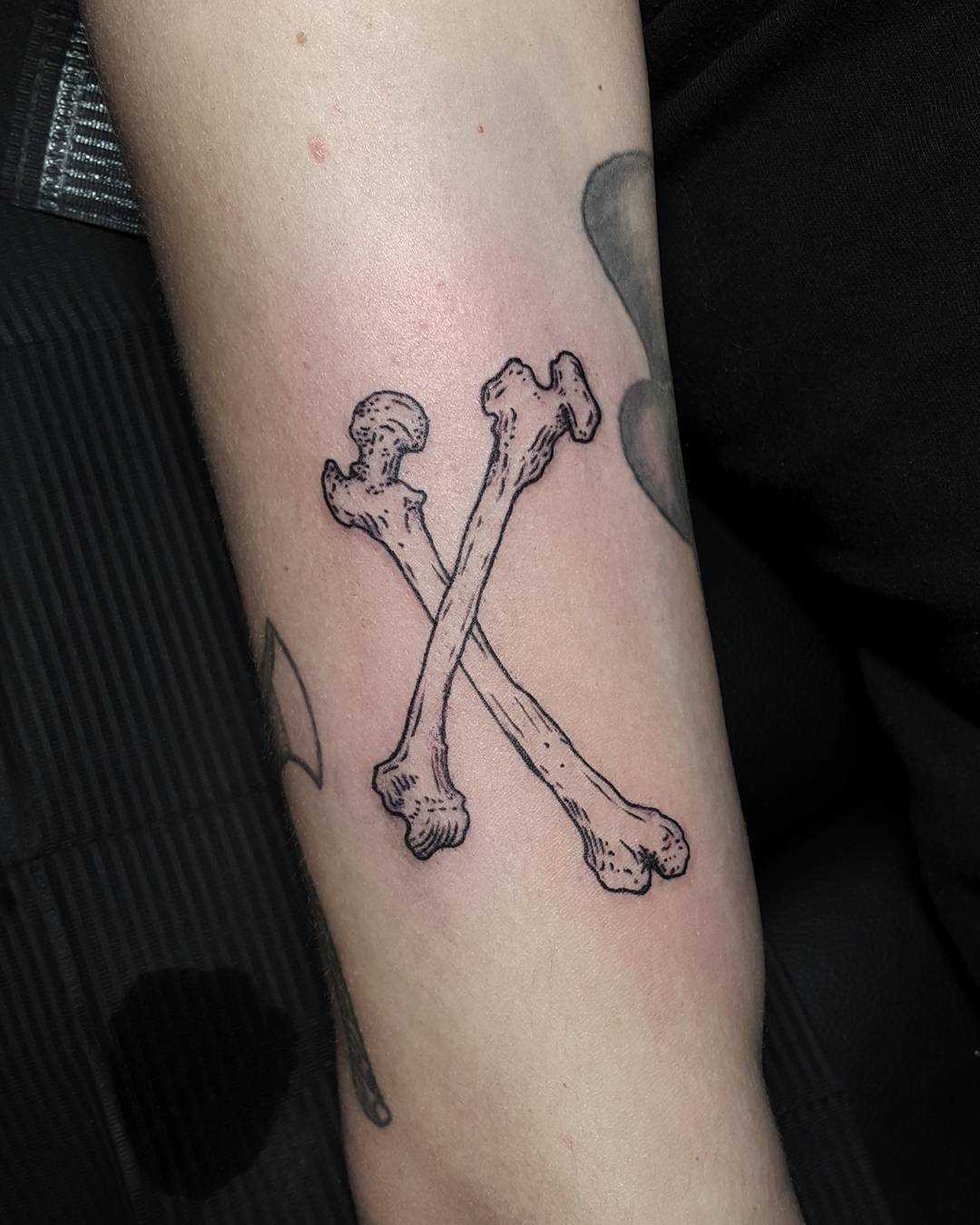 Crossed bones tattoo