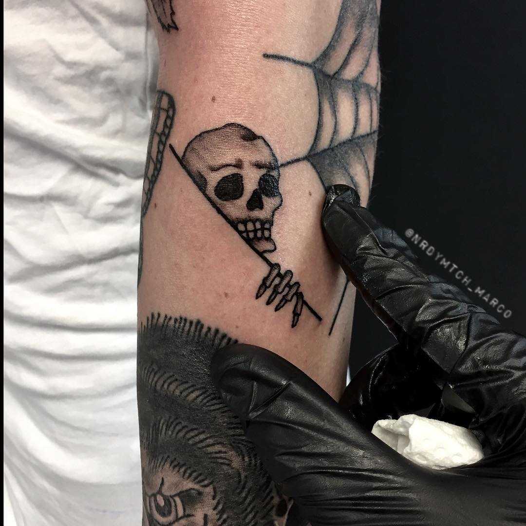 Curious skeleton tattoo by Nerdy Match