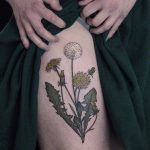 Dandelions tattoo on the thigh