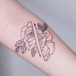 Divided rose tattoo