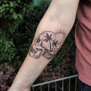 Double exposure skull and beach tattoo