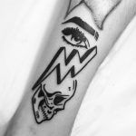 Eye, lightning bolt, and skull tattoo