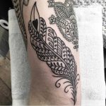 Feather tattoo by Valeria Marinaci