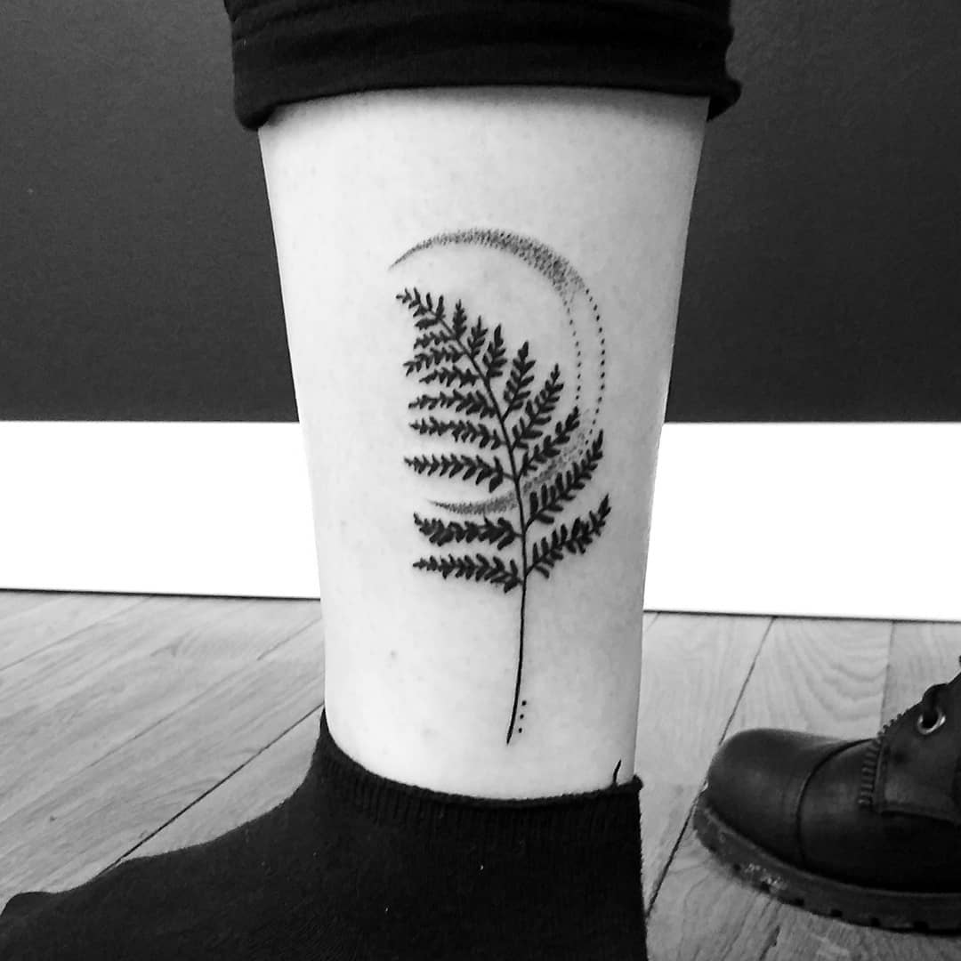 Fern leaf and crescent moon tattoo