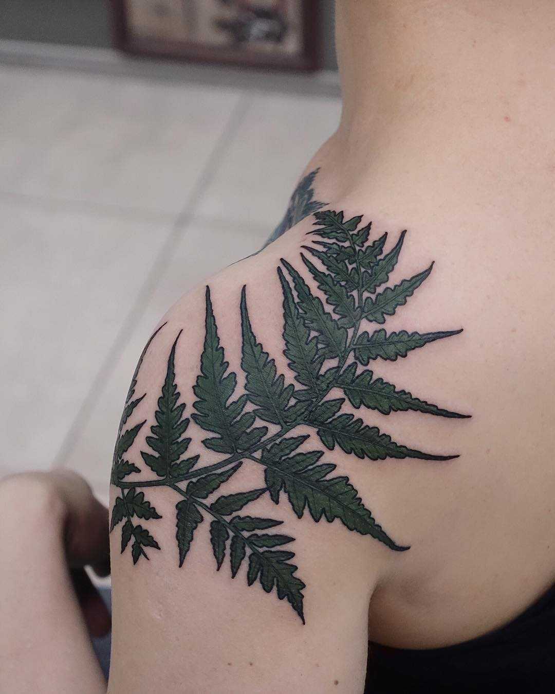 Fern leaf tattoo on the shoulder