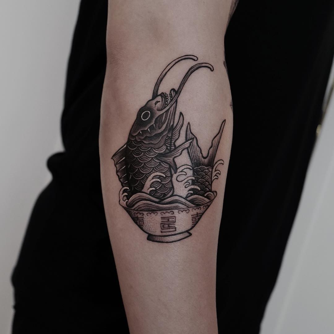 Fish in a bowl done at Lighthouse Professional Tattoo