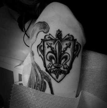 Fleur-de-lis and shield tattoo