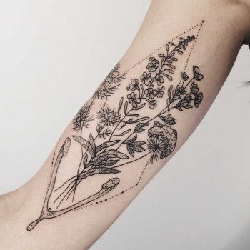 Flora of Alaska and wishbone tattoo by Pony Reinhardt