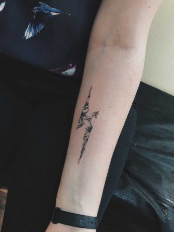 Floral lightning bolt tattoo