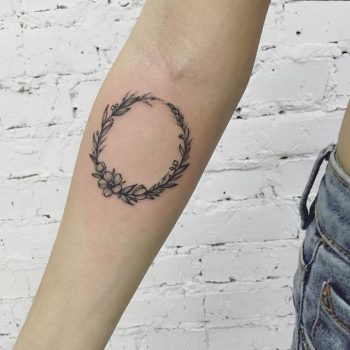 Floral wreath tattoo by Anna Bravo