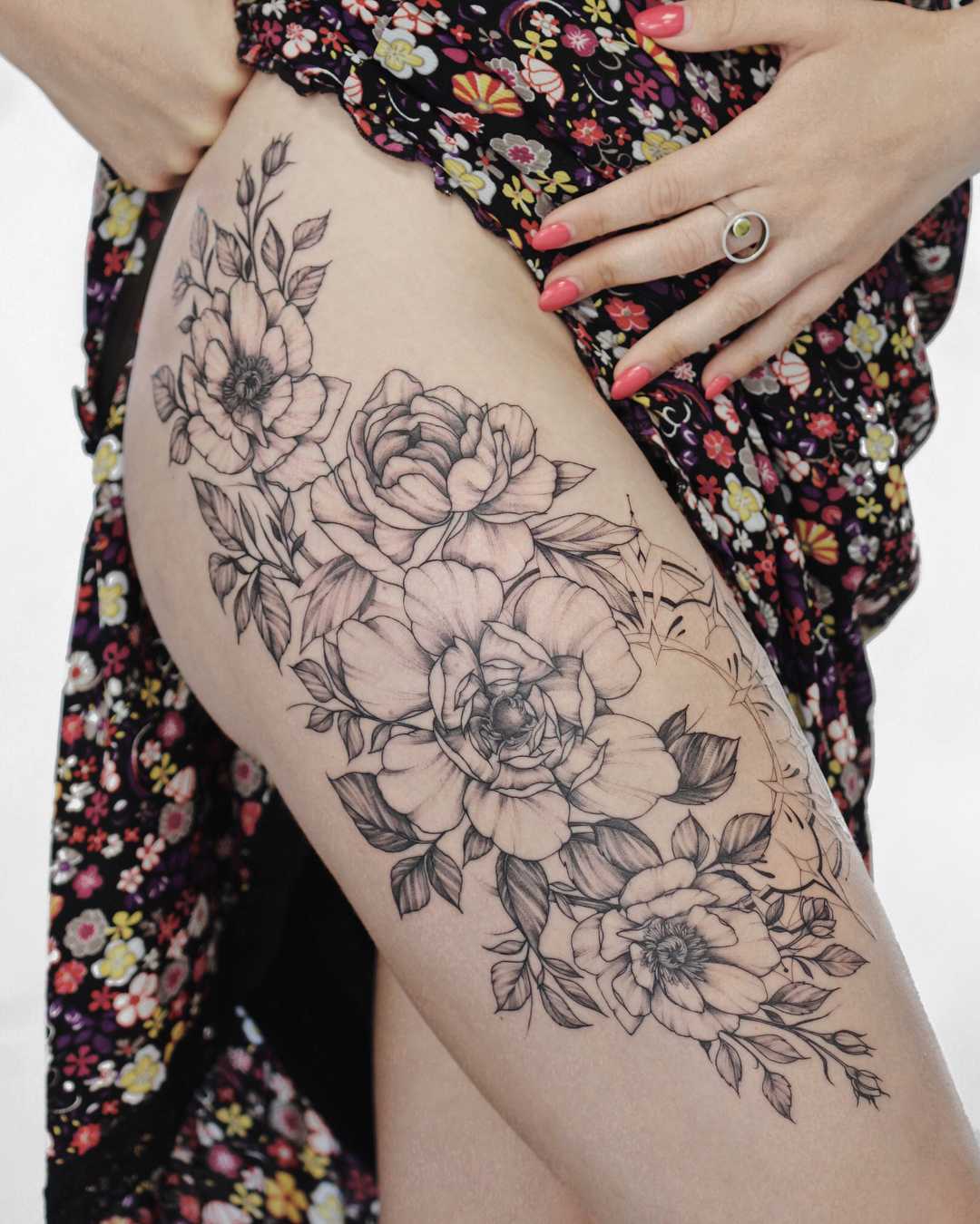 Gorgeous floral tattoo on the thigh