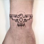 Hand-poked Thunderbird tattoo