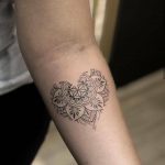Heart-mandala tattoo