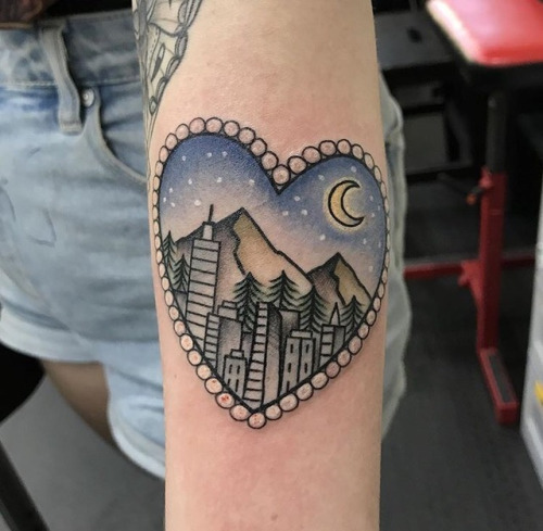 Heart-shaped city scenery tattoo