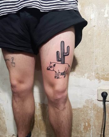 Hog and cactus tattoo on the thigh