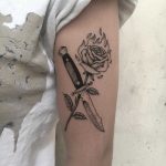 Knife and burning rose tattoo