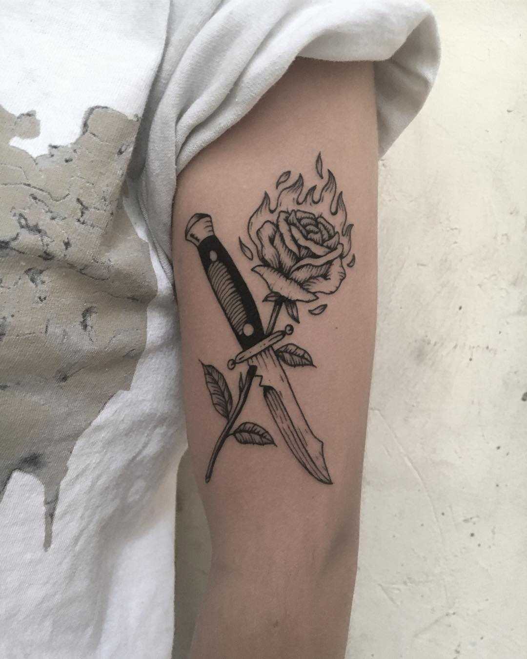 Knife and burning rose tattoo