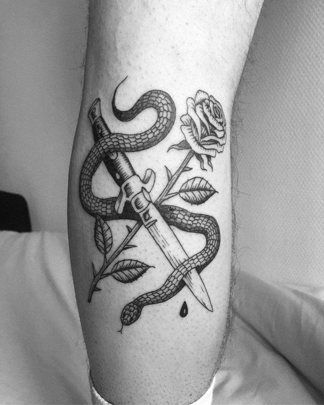 Knife, snake, and rose tattoo