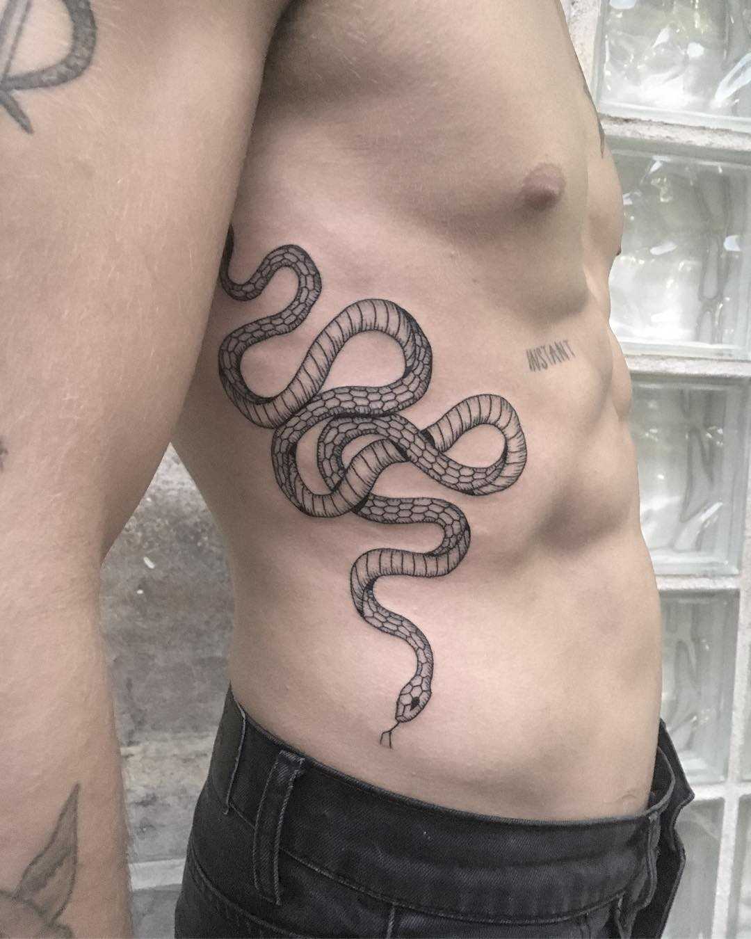 Large snake tattoo on the side