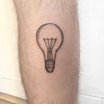 Light bulb tattoo on the calf