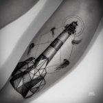 Lighthouse tattoo by Mark Ostein