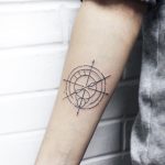Linear minimalist compass tattoo