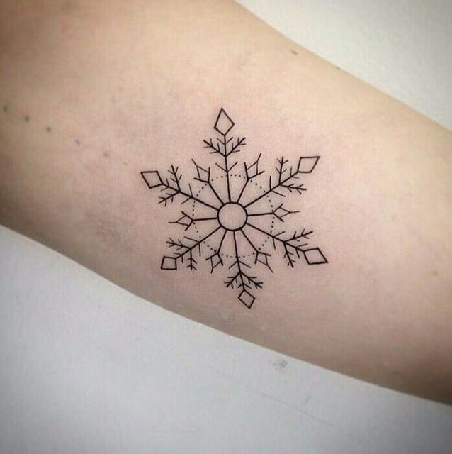 Little linear snowflake tattoo