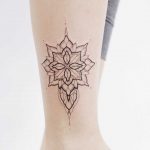 Lovely shape tattoo on the calf