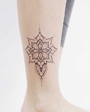 Lovely shape tattoo on the calf
